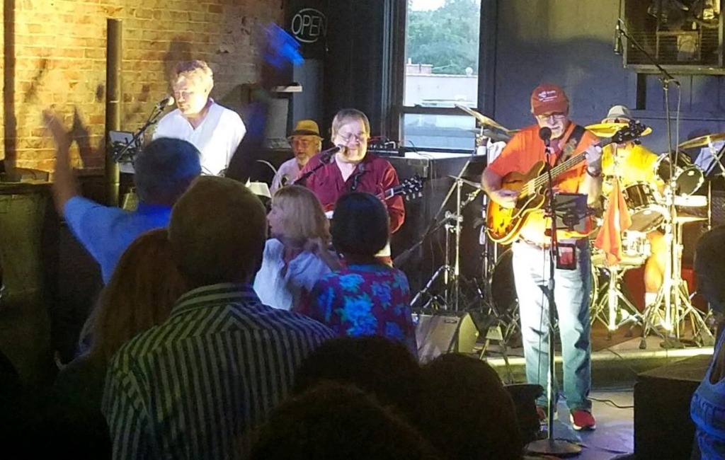 The Missing Links, L to R: Doug Pope (67, white shirt), Brad Mansfield (67, background),Ken Reeves (68), John Ziegler (67, orange shirt), Jim Ziegler (on drums, sitting in for original drummer Dan Householder 67, who was not able to attend).