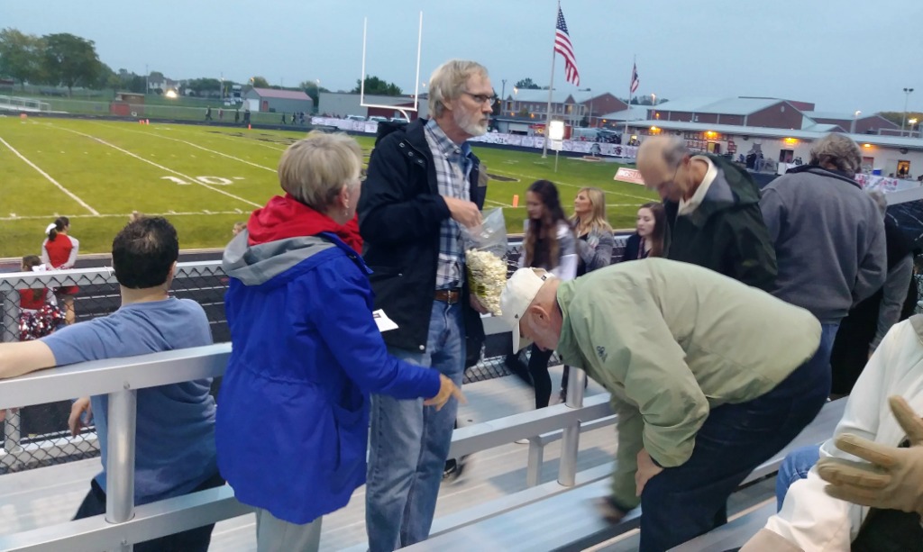 Fri. night BGHS football game. (L-R): Susie (Baker) Hoane (Class of 66), Tom Claflin (Class of 66), Ron June, Tom Hoane, back of Terry Kriedler (Class of 66), shoulder of Beth (Noe) June. Submitted by Linda (Louys) Misak.