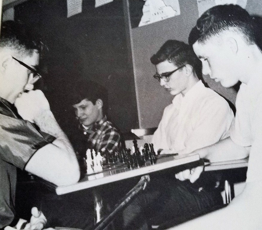 From 1966 Yearbook, Sophomore year.
John Leland (far left) and Art Claflin (far right). Strategizing their next moves on a chess board.